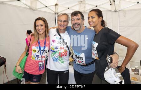 Laurent Petitguillaume, Stephane Plaza et Karine le Marchand au 20 kilomètres de Paris, une course sur route de 20 kilomètres qui commence au Pont d'Iena au pied de la Tour Eiffel à Paris, France, le 13 octobre 2019. Photo de Loic Baratoux/ABACAPRESS.COM Banque D'Images