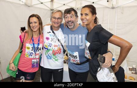 Laurent Petitguillaume, Stephane Plaza et Karine le Marchand au 20 kilomètres de Paris, une course sur route de 20 kilomètres qui commence au Pont d'Iena au pied de la Tour Eiffel à Paris, France, le 13 octobre 2019. Photo de Loic Baratoux/ABACAPRESS.COM Banque D'Images