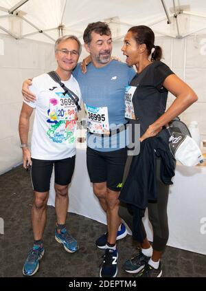 Laurent Petitguillaume, Stephane Plaza et Karine le Marchand au 20 kilomètres de Paris, une course sur route de 20 kilomètres qui commence au Pont d'Iena au pied de la Tour Eiffel à Paris, France, le 13 octobre 2019. Photo de Loic Baratoux/ABACAPRESS.COM Banque D'Images