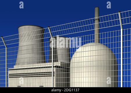 Centrale nucléaire derrière une barrière contre un bleu arrière-plan Banque D'Images