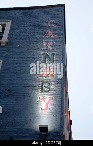 Carnaby Street London - Enseigne peinte sur le côté d'un immeuble dans le quartier de Soho de Londres, Carnaby est célèbre comme le cœur de swinging London dans les années 60 Banque D'Images