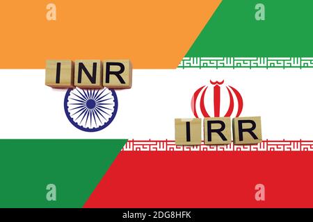 Les codes de devises de l'Inde et de l'Iran sur fond de drapeaux nationaux. Concept de transfert d'argent international Banque D'Images