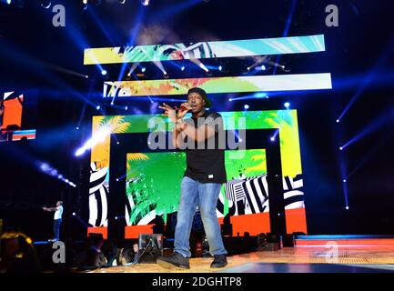 Dizzee Rascal en scène pendant le Jingle Bell ball de Capital FM 2013 à l'O2 Arena, Londres. Banque D'Images