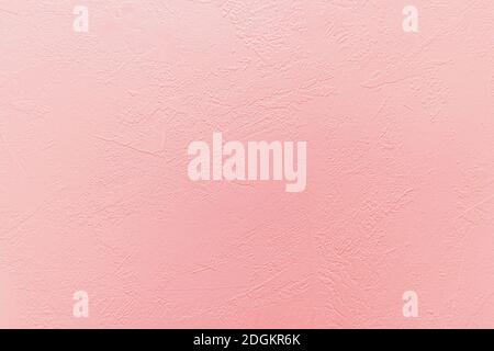 Fond en béton rose avec motif abstrait texturé appliqué à la surface. Banque D'Images
