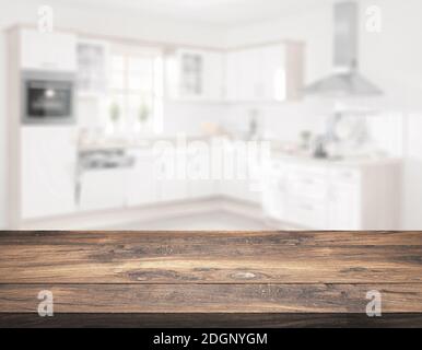 Table en bois devant la cuisine floue - Illustration Banque D'Images