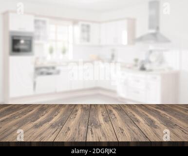 Table en bois devant la cuisine floue - Illustration Banque D'Images