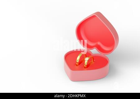 Boîte en forme de coeur avec deux anneaux de mariage isolés sur fond blanc. illustration 3d. Banque D'Images