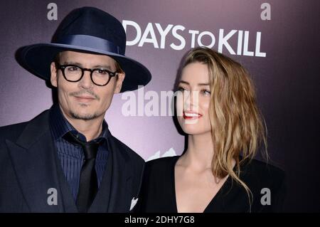 Photo du dossier : Johnny Depp et Amber entendu assister à la première de '3 Days to Kill' aux cinémas ArcLight de Los Angeles, CA, Etats-Unis le 12 février 2014. L'acteur Johnny Depp et sa femme Amber ont entendu divorcer après 15 mois de mariage. Amber, 30 ans, a cité des différences irréconciliables et cherche à obtenir le soutien du conjoint de l'étoile Pirates des Caraïbes, selon les dossiers judiciaires. La paire, qui n'ont pas d'enfants ensemble, s'est mariée en février de l'année dernière après avoir cojoué dans le film de 2011 le journal de Rum. Photo de Lionel Hahn/ABACAPRESS.COM Banque D'Images