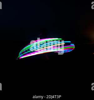 Hula Hoop psychédélique la nuit Banque D'Images