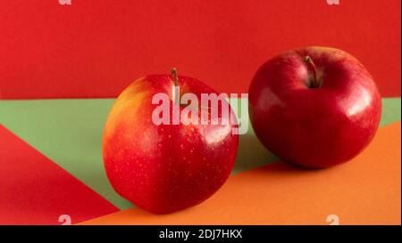 One ripe red Apple. Two red apples. Isolated on the background. Stock Photo