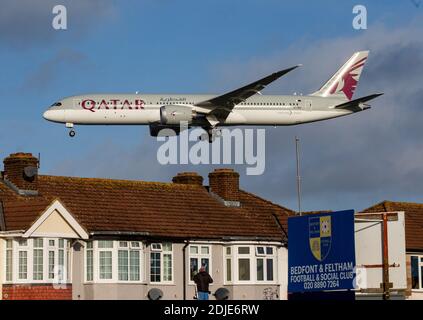 A Qatar Airways airplane coming in to land at Heathrow airport. Stock Photo