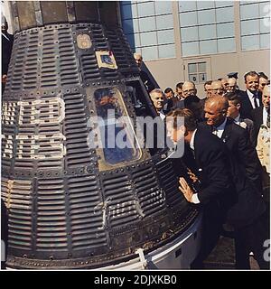 United States President John F. Kennedy inspects interior of 'Friendship 7' on February 23, 1962 at Hanger S, Cape Canaveral, Florida. The President presented the NASA Distinguished Service Medal (DSM) to Astronaut Glenn. Left to right: President Kennedy, Lieutenant Colonel John H. Glenn, Jr., others. .Mandatory Photo by Cecil Stoughton - The White House via CNP/ABACAPRESS.COM Stock Photo