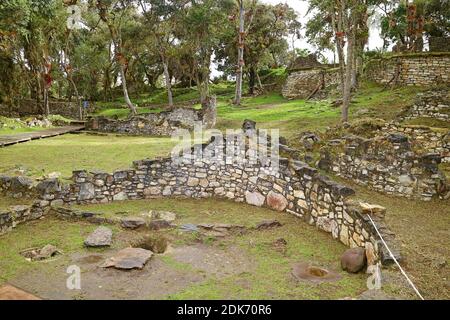 Stone round house ruins inside the lost city of ancient Kuelap fortress, archaeological site in Amazonas region of northern Peru Stock Photo