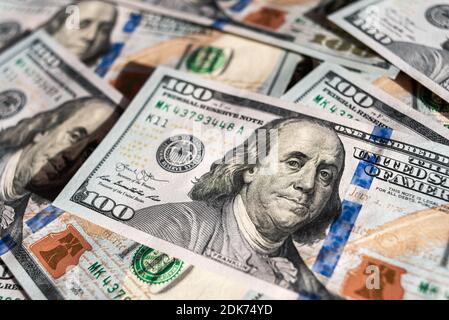 Official currency of the US. Dollar, abbreviation USD. Set of one hundred dollar bills close up. American money. Stock Photo