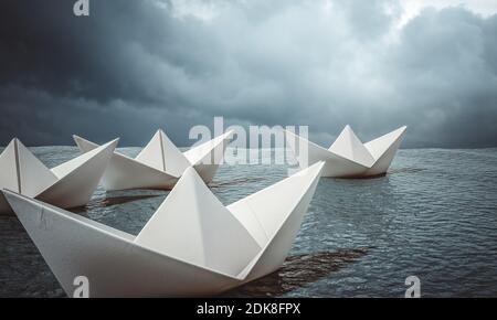 groupe de bateaux en papier naviguant dans l'océan. concept de courage et de vision. rendu 3d. Banque D'Images