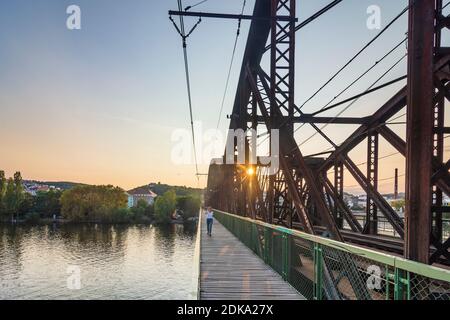 Praha, river Vltava (Moldau), railway bridge at Vysehrad, view to North, person walking in Vltava, Moldau, Praha, Prag, Prague, Czech Stock Photo