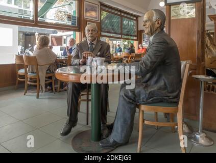 Statues of Argentine writers Jorge Luis Borges and Adolfo Bioy Casares in La Biela cafeteria, Recoleta, Buenos Aires, Argentina Stock Photo