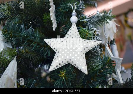 Christmas tree with decorations, balls, stars and garlands. Christmas background Stock Photo