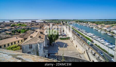 view over the roofs and ramparts of the medieval walled town of Aigues-Mortes and the Canal du Rhône à Sète, Petite Camargue, Gard department, Occitan Stock Photo