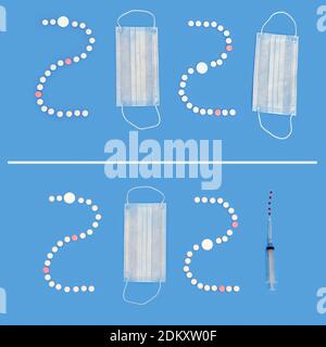 Numéros 2020 et 2021 du masque médical et de la seringue avec vaccin sur fond bleu. Concept de vaccin contre le coronavirus en 2021 ans Banque D'Images
