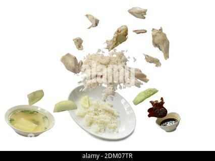 steamed rice topping boiled chicken floating on plate with sauce and soup in white background Banque D'Images