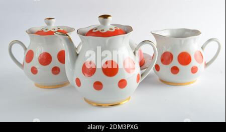 A set of rare ceramic teapots, sugar bowls on a white background Stock Photo