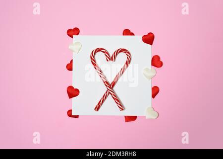 Valentines day or wedding mockup scene with blank card, paper hearts confetti, empty space for your text, top view. Stock Photo