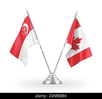 Drapeaux de table du Canada et de Singapour isolés sur le rendu 3D blanc Banque D'Images