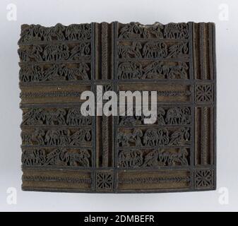 Printing block, Medium: wood Technique: carved, Carved block design shows squares containing very small animals arranged in rows. These squares are separated by strips with little medallions at crossings. Design is in relief. Block would print one corner of the pattern., India, 19th century, appliances & tools, Printing block Stock Photo