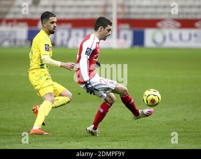 Imran Louza of FC Nantes, Mathieu Cafaro of Reims during the French championship Ligue 1 football match between Stade de Reims a / LM Stock Photo