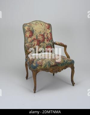 Armchair, wood, metal, tapestry, This set of chairs (2) consists of two antique Aubusson tapestry covered armchairs of the Louis XV period. The armchairs' curved backs and seats are upholstered in reddish-blue floral fabric. The wooden armrails are upholstered on their upper side. The fabric is attached via metallic buttons. The frontal part of the seat bottom is decorated in a wood, in a carved floral motif., France, 18th century, furniture, Decorative Arts, Armchair Stock Photo