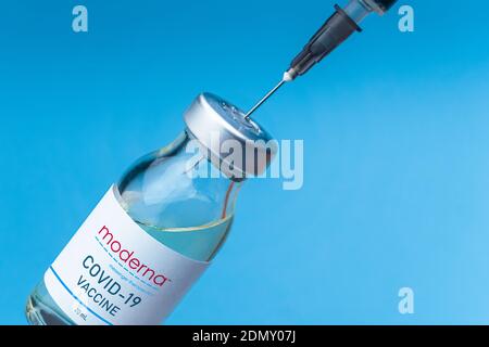 Izmir, Turkey - August 11 2020: Coronavirus vaccine concept and background. New vaccine moderna isolated on blue background. Covid-19, 2019-nCov pande Stock Photo