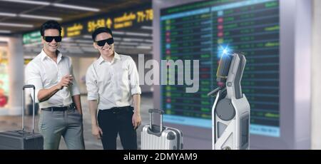 new normal technology in smart hospitality industry 4.0 . reception robot assistant using for help customer or passenger in airport with welcome passe Stock Photo