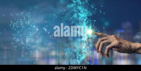 man hand pointing in to futuristic interface network include of artificial intelligence(ai), machine deep learning, robot computer software, digital t Stock Photo