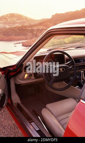 Dash board and interior of a 1991 Jaguar XJS Coupe driving in the South of France. Stock Photo