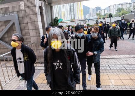 Pro-democracy activists (L-R) Tang Sai-lai, 'Long Hair' Leung Kwok-hung, Eddie Chu and Figo Chan ahead of the court hearing.Pro-democracy activists arrive at the West Kowloon Magistrates' Court for charges of the illegal assembly in connection with a protest on 1st July 2020. Stock Photo