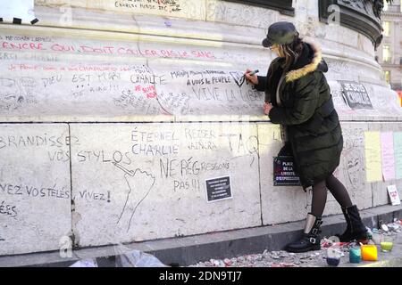 Flowers, candles, messages and pens honouring the 17 people who died in the Charlie Hebdo and the Hyper Cacher Vincennes massacres on January 07, 2015. The memorial is held at the Place de la Republique in Paris, France and is still constantly visited by mourners on January 12, 2015. Photo by Aurore Marechal/ABACAPRESS.COM Stock Photo