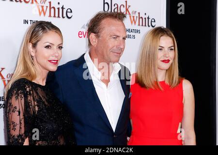 Christine Baumgartner, Kevin Costner et sa fille Lily Costner assistent à la première de Noir ou blanc au Regal Cinemas L.A. EN DIRECT, à Los Angeles, CA, Etats-Unis, le 20 janvier 2015. Photo de Chris Elise/ABACAPRESS.COM Banque D'Images