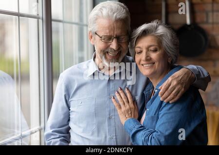 Loving older senior family couple enjoying tender sweet moment. Stock Photo