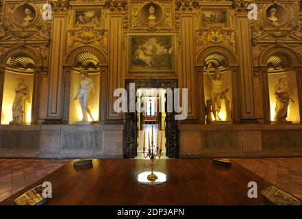 A view of the gallery of Carracci, with the frescoes 'The Loves of the Gods' by Annibale and Agostino Carracci at Palazzo Farnese in Rome , Italy on february 2014. Palazzo Farnese, which currently houses the French embassy is the most monumental of Roman Renaissance palaces, in Rome, Italy. First designed in 1517 for the Farnese family, the palace building expanded in size and conception when Alessandro Farnese became Pope Paul III in 1534. Its building history involved some of the most prominent Italian architects of the 16th century.After the extinction of the Farnese family it passed by inh Stock Photo