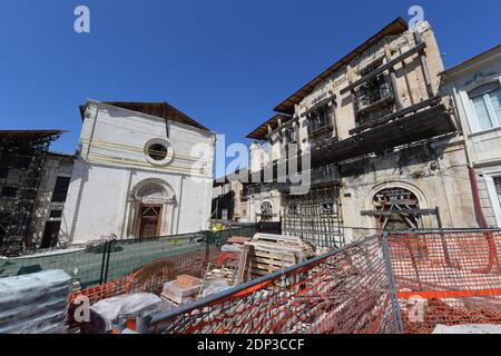 A view the city of L'Aquila , Italy on April 9, 2015 six years after the earthquake. Six years after L'Aquila still lies in ruins. The city is a ghost town. Its squares and alleyways are deserted, while damaged medieval buildings are being propped up on steel supports. Six years later much of the medieval centre remains uninhabitable.The earthquake hit L'Aquila and surrounding villages on April 6, 2009, devastating the city's medieval core and flattening homes and offices. It left 309 people dead, with almost 2,000 suffering injuries and leaving some 80,000 people homeless. Some 10,000 buildin Stock Photo