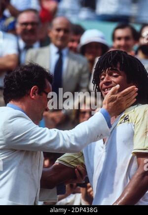 Philippe Chatrier congratulates France's Yannick Noah winner of the French Tennis Open against Sweden's Mats Wilander In Roland-Garros Stadium, Paris, France on May 23th, 1983. Photo by Henri Szwarc/ABACAPRESS.COM Stock Photo