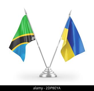 Drapeaux de table de l'Ukraine et de la Tanzanie isolés sur le rendu 3D blanc Banque D'Images