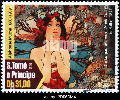 Femme peinte par Alfons Mucha sur timbre-poste Banque D'Images