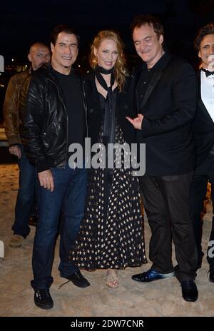 John Travolta, Uma Thurman, Quentin Tarantino assister à une projection en bord de mer organisée pour le 20e anniversaire du film de Quentin Tarantino 'Pulp Fiction' dans le cadre du 67ème Festival de Cannes, le 23 mai 2014. Photo de Lionel Hahn/ABACAPRESS.COM Banque D'Images