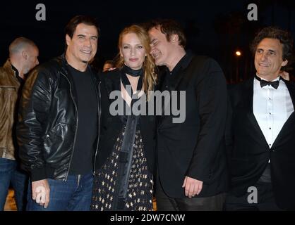 John Travolta, Uma Thurman, Quentin Tarantino, Lawrence Bender assister à une projection en bord de mer organisée pour le 20e anniversaire du film de Quentin Tarantino 'Pulp Fiction' dans le cadre du 67ème Festival de Cannes, le 23 mai 2014. Photo de Lionel Hahn/ABACAPRESS.COM Banque D'Images
