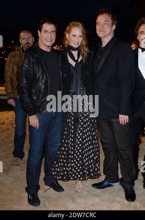 John Travolta, Uma Thurman, Quentin Tarantino assister à une projection en bord de mer organisée pour le 20e anniversaire du film de Quentin Tarantino 'Pulp Fiction' dans le cadre du 67ème Festival de Cannes, le 23 mai 2014. Photo de Lionel Hahn/ABACAPRESS.COM Banque D'Images
