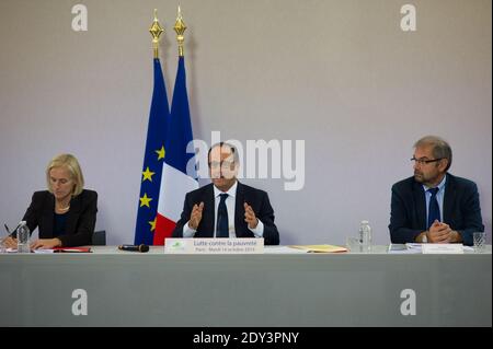 Le Président François Hollande dirige une table ronde avec des groupes de charité, Segolene Neuville (L) secrétaire d'Etat en charge des personnes handicapées et de la lutte contre l'exclusion et François Chereque (R) responsable de l'agence de service civique (Agence du Service civique) le 14 octobre 2014 à Paris, France, Pour discuter du rapport annuel de l'agence "Goods to Donnez", un groupe qui lutte contre le gaspillage en organisant des dons de biens de base aux pauvres de France. Photo de Thierry Orban/ABACAPRESS.COM Banque D'Images