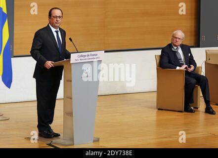 Le président français François Hollande prononce son discours, comme le roi de Suède Carl XVI Gustaf le regarde lors d'une conférence sur le réchauffement climatique au Collège de France à Paris, en France, le mercredi 3 décembre 2014. Photo Pool par Remy de la Mauviniere/ABACAPRESS.COM Banque D'Images