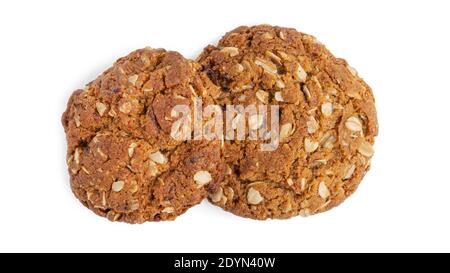 Biscuits aux flocons d'avoine avec raisins secs et noix de coco sur fond blanc. Vue du dessus. Photo de haute qualité Banque D'Images